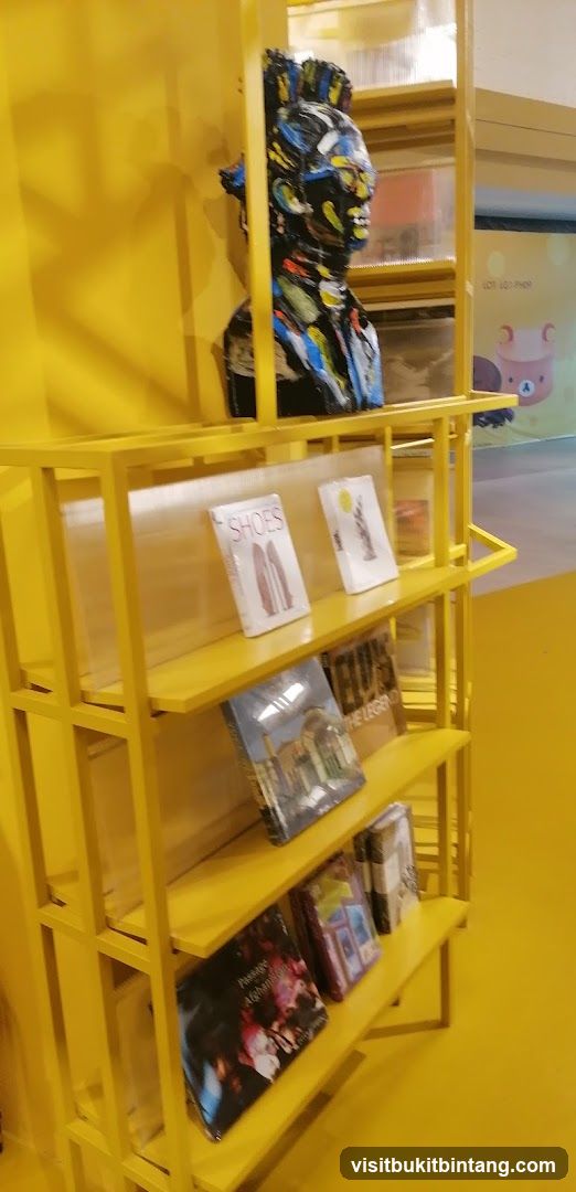Yellow Display Shelf with Artifacts and Books