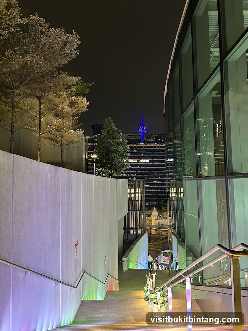 Night View of Modern Architecture with Cherry Blossoms