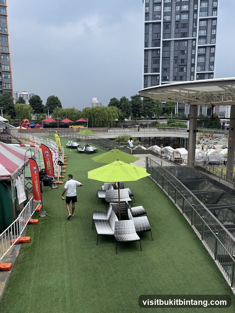 Outdoor Event Area with Green Umbrellas and Seating