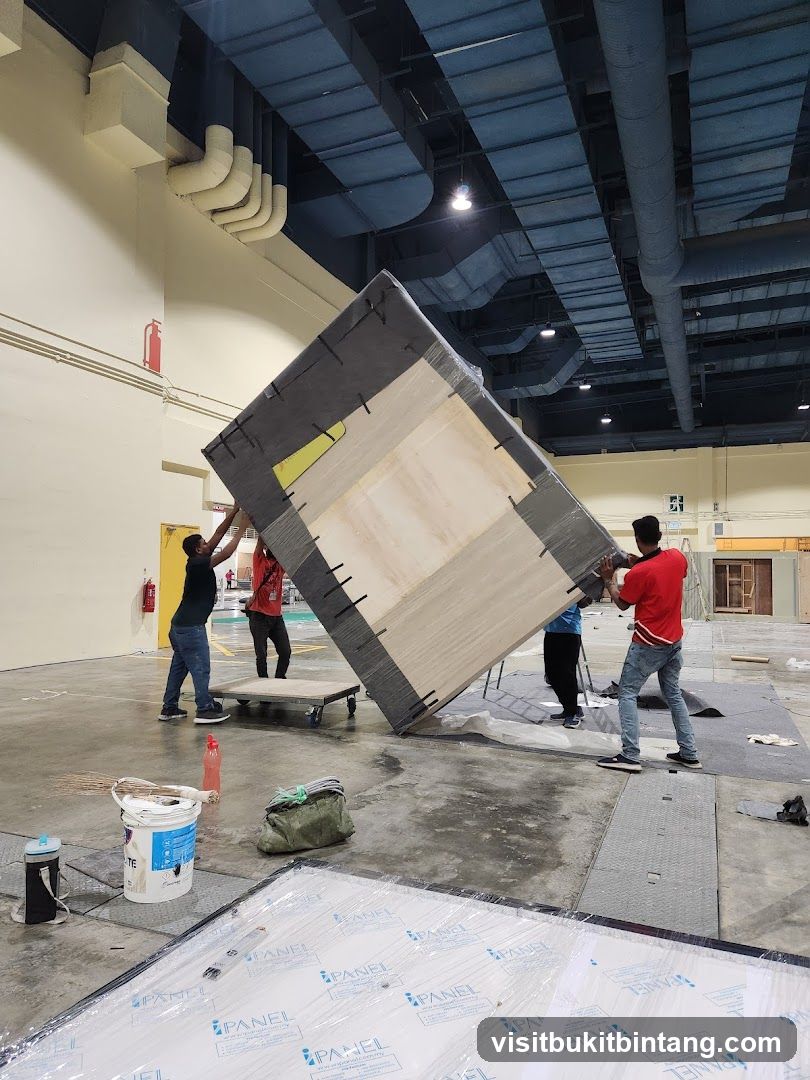 Construction workers moving a large panel