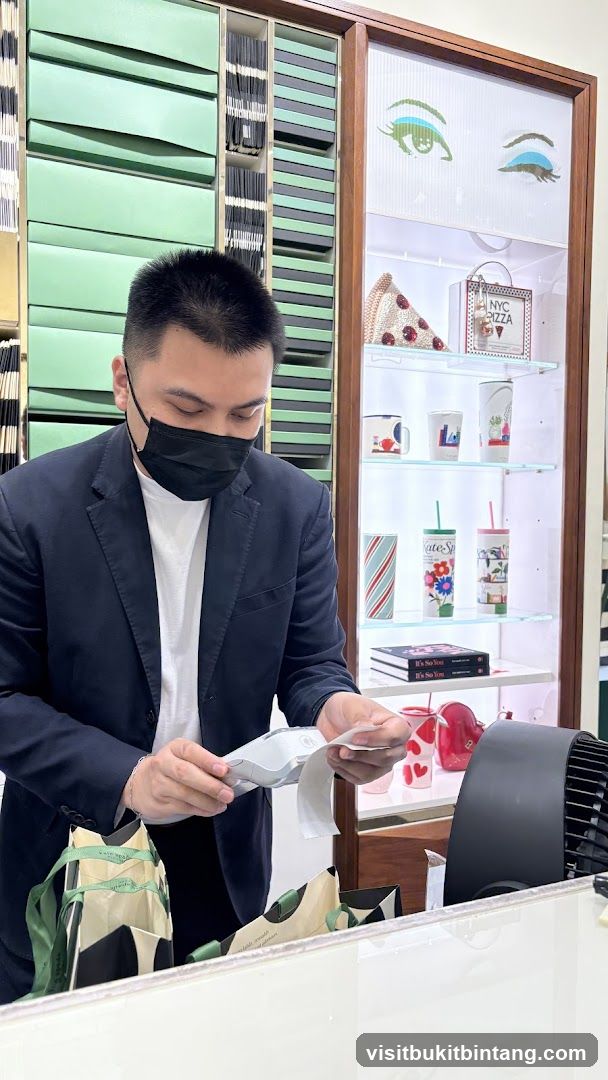Man at Counter with Merchandise
