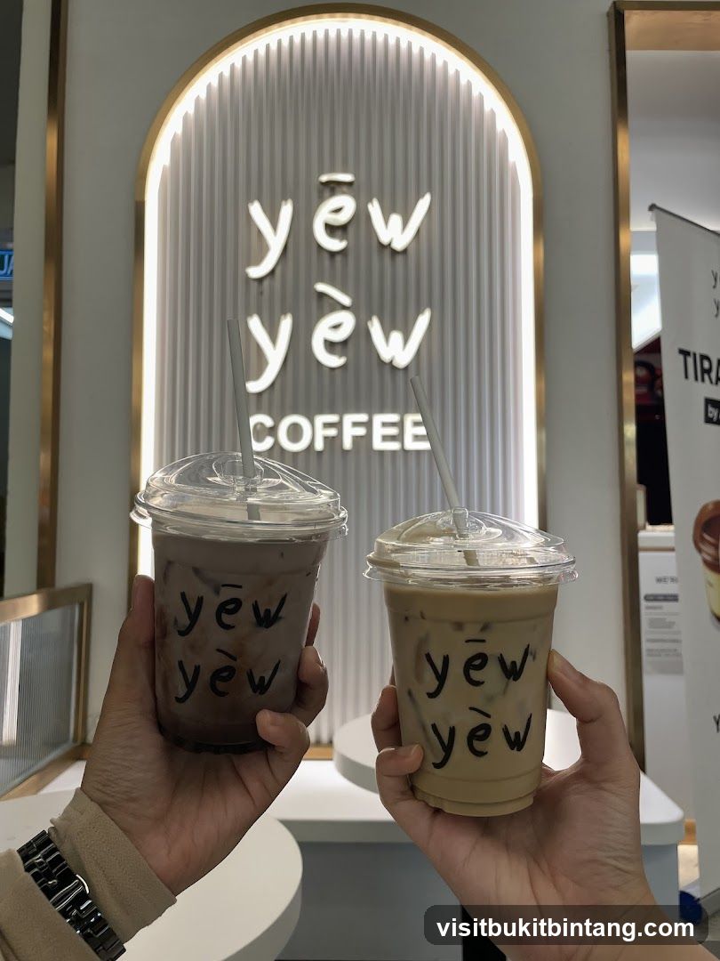 Two iced coffee drinks with the shop's logo