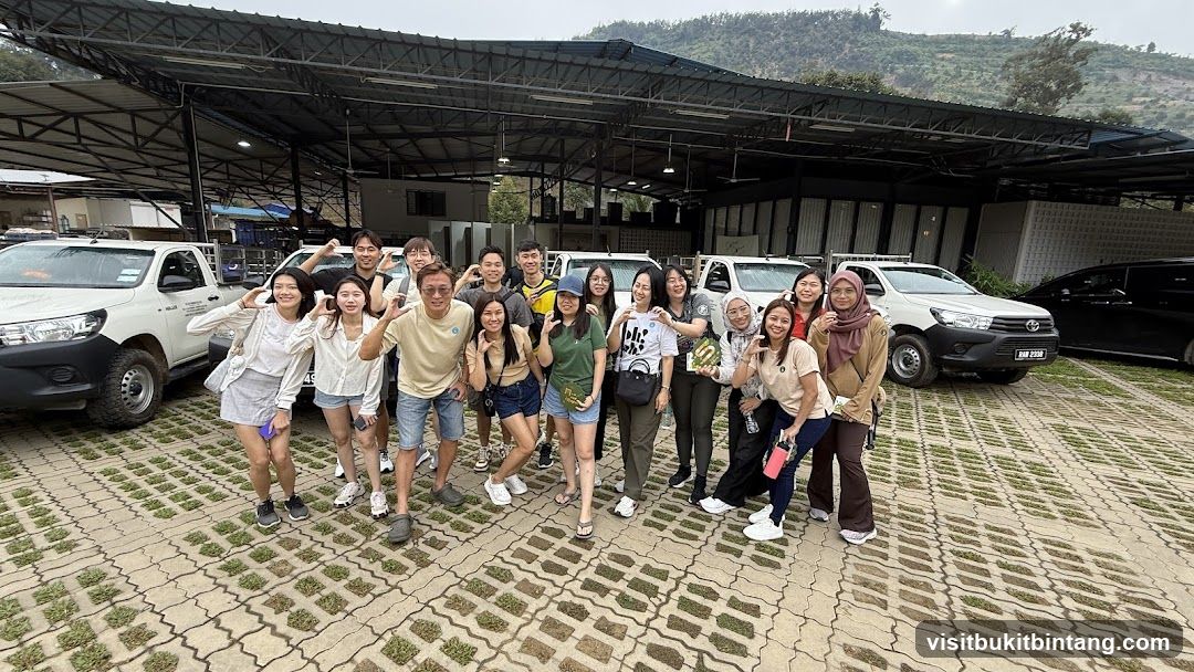 Group posing for a photo with vehicles