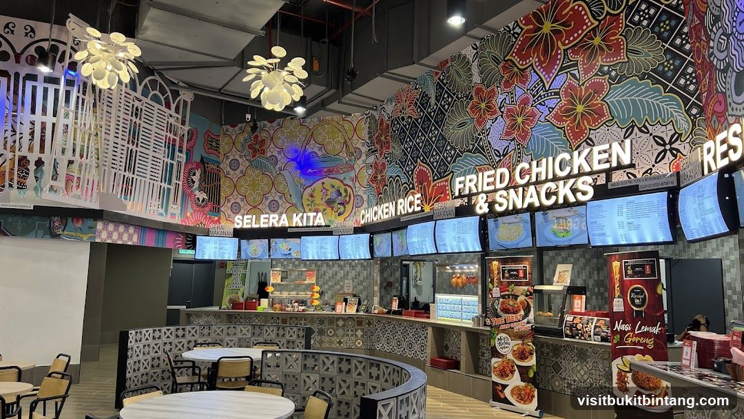 Food court with vibrant murals and digital menus