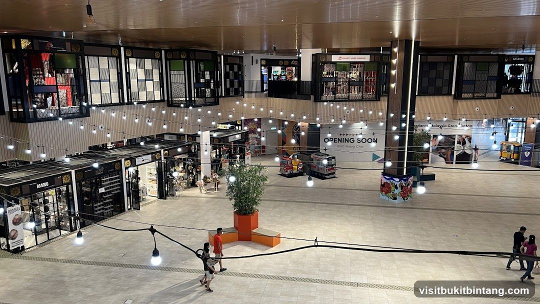 Indoor shopping mall with various shops and decorations