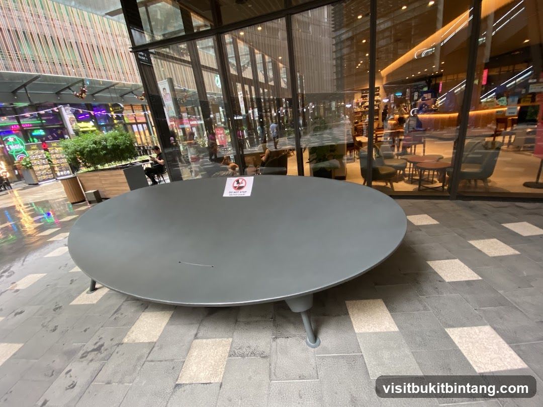 Outdoor seating area with a large circular table