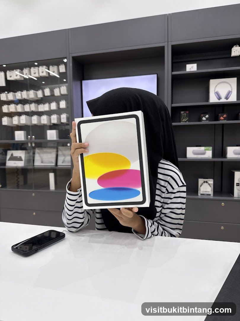 Person holding an iPad box