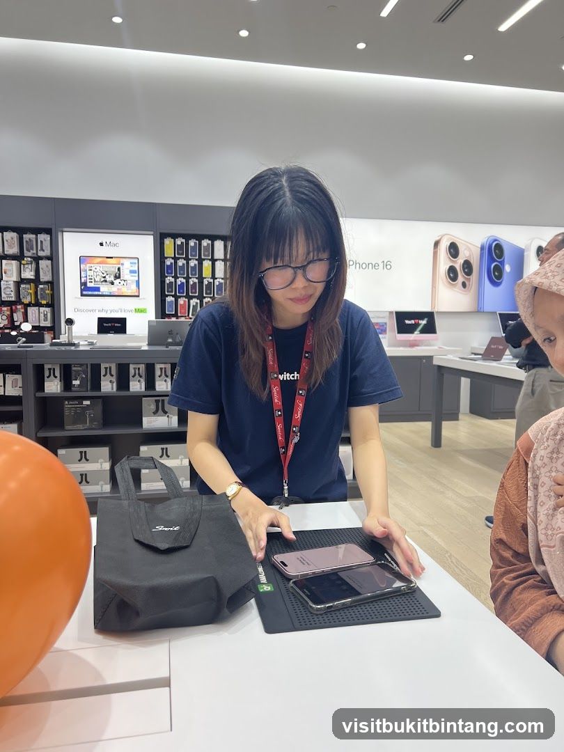 Salesperson showing phones
