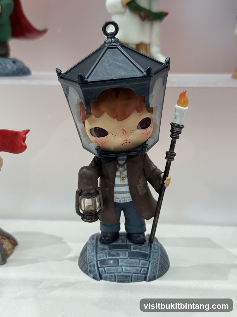 Figurine of a boy with a lantern head