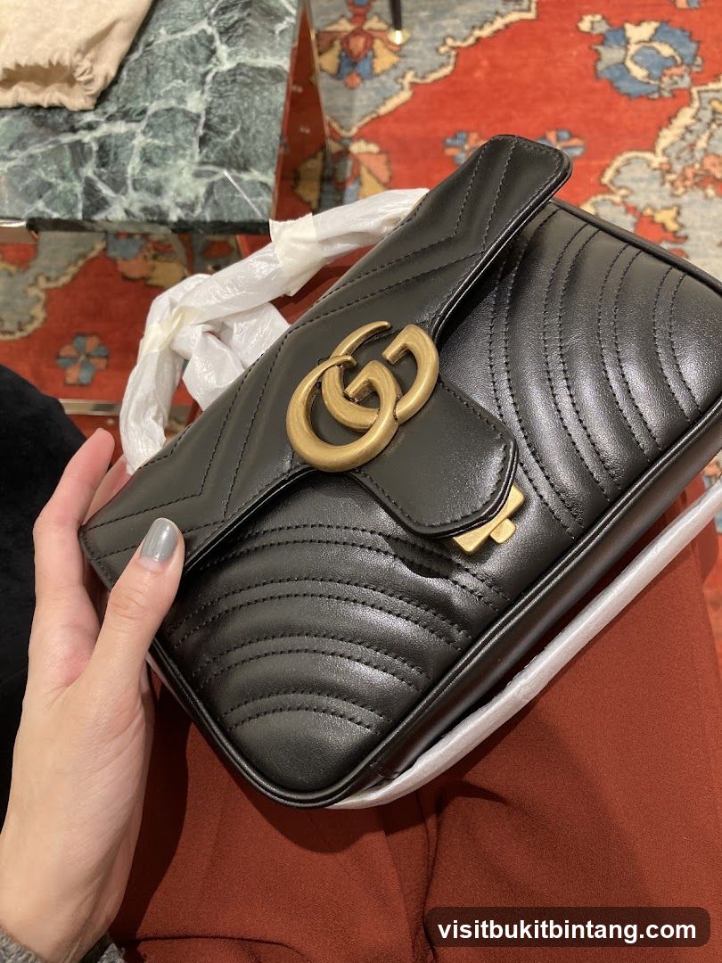 Black Quilted Leather Handbag with Gold GG Logo