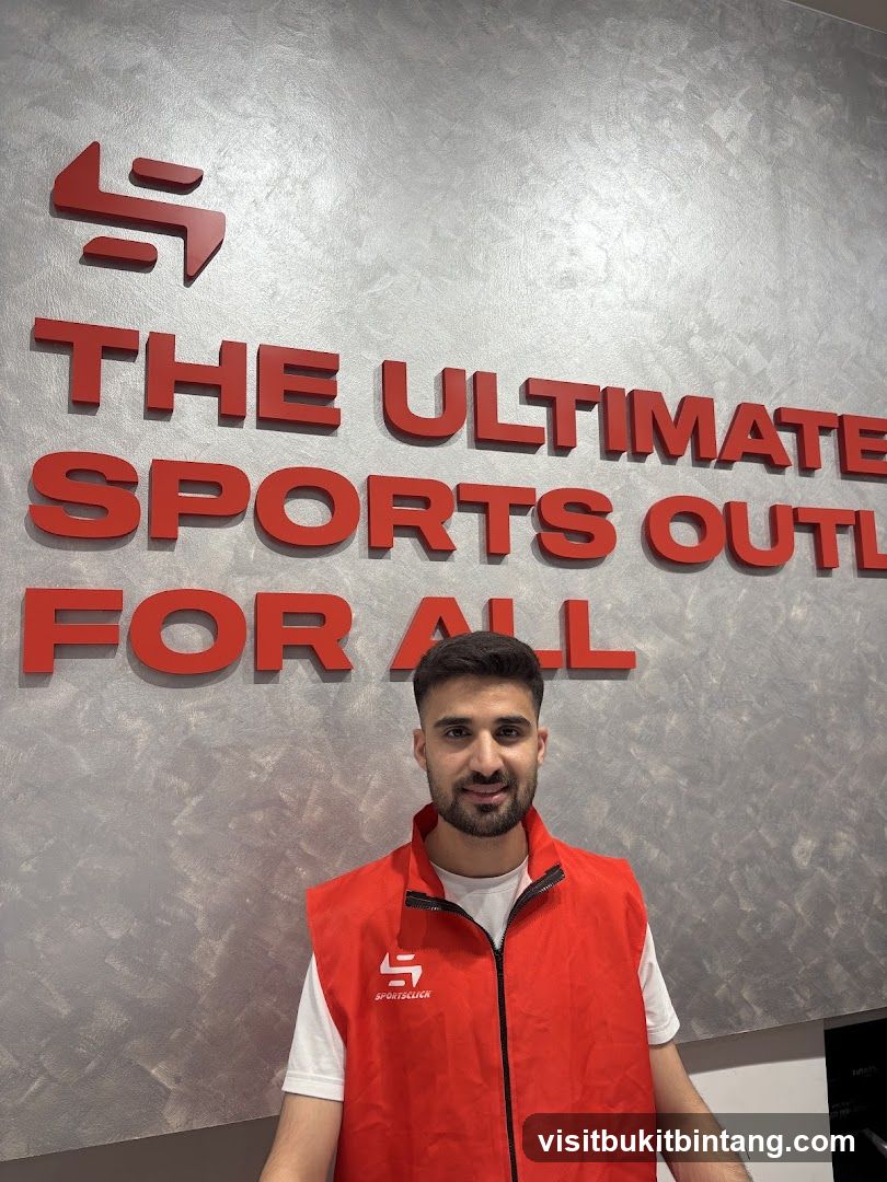 Man in front of store sign