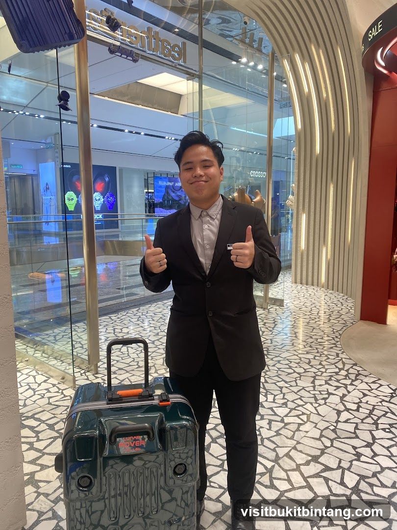 Man with Suitcase Giving Thumbs Up