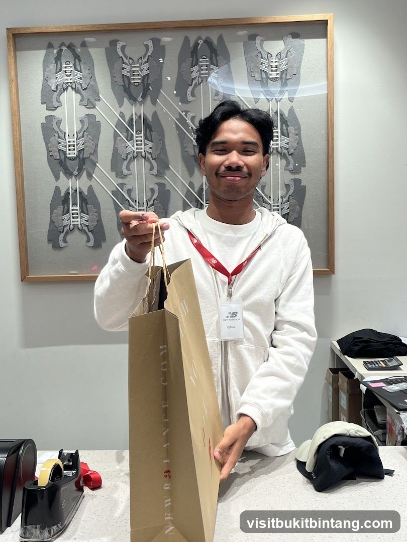 Employee holding a shopping bag