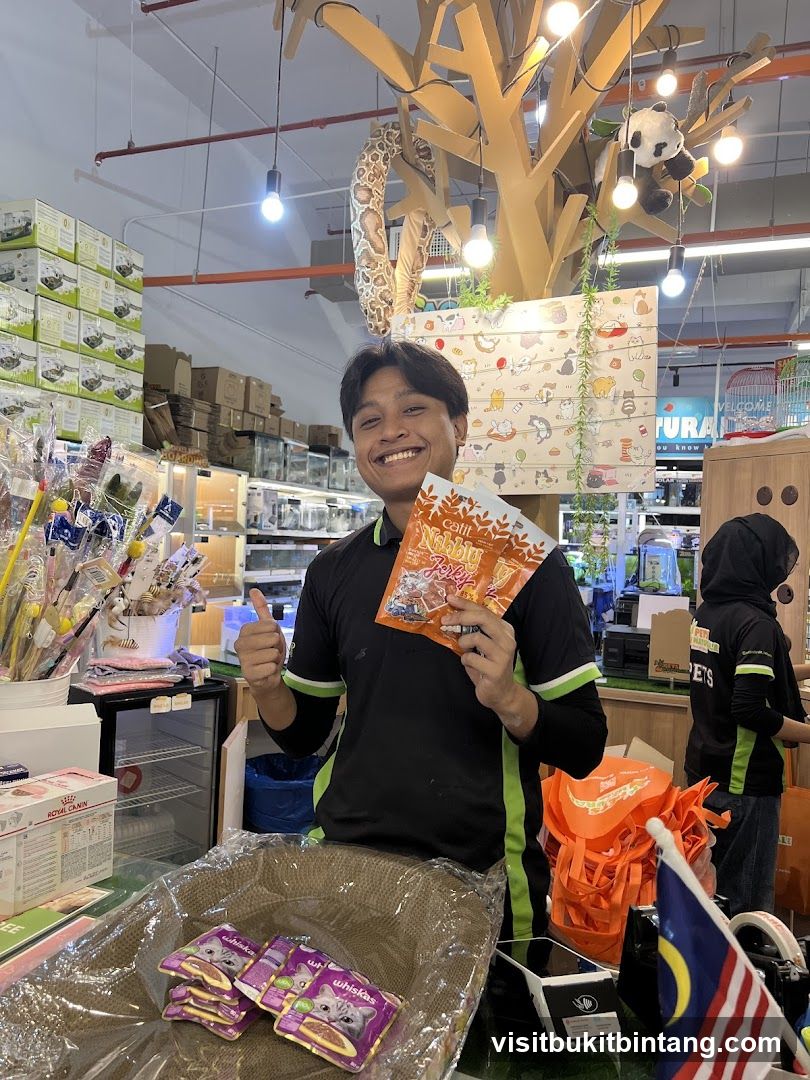 Pet Store Employee Holding Cat Treats