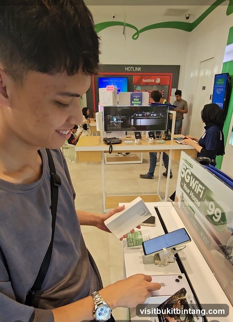 Customer examining a phone box