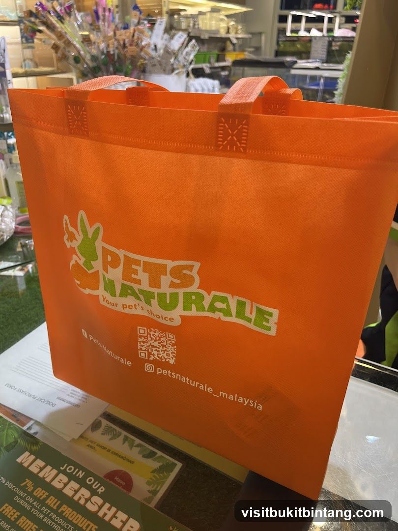 Orange tote bag with pet store logo