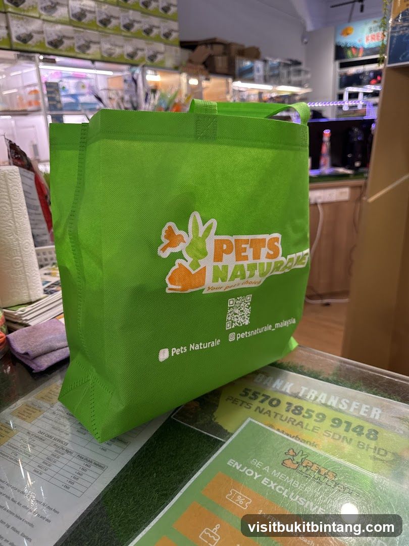 Green tote bag with pet store logo