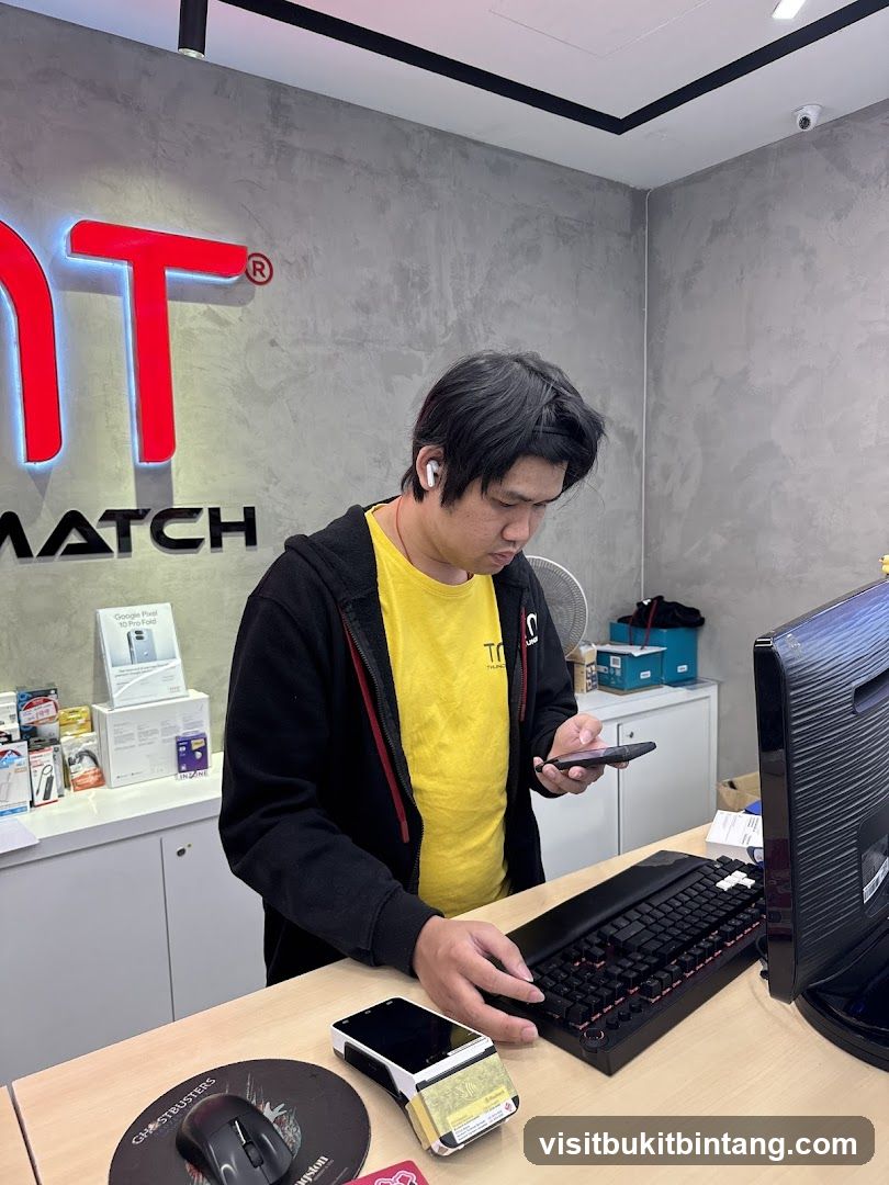 Man at a counter with electronics