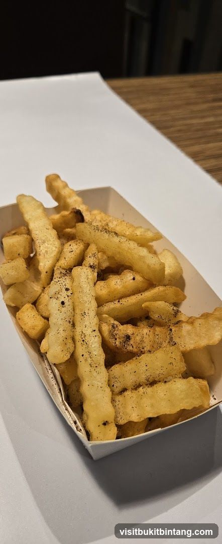 Seasoned Fries in Paper Container