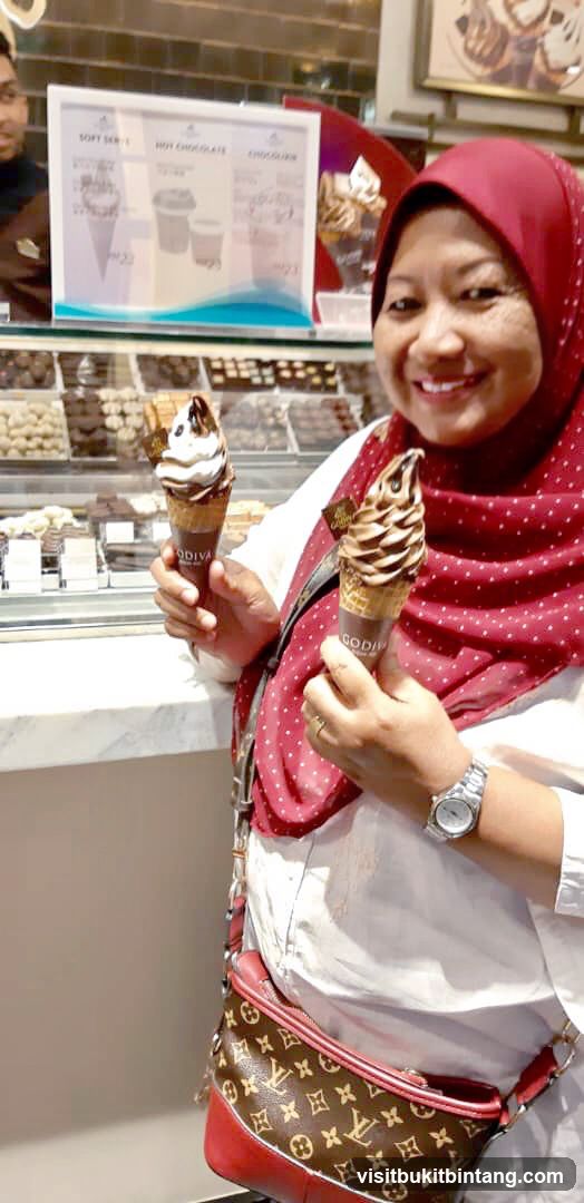 Woman holding Godiva ice cream cones