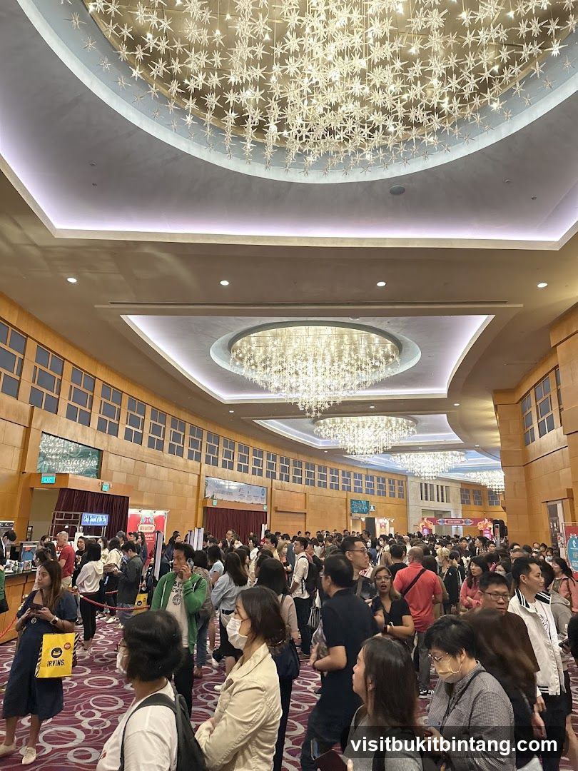 Crowded Convention Hall with Ornate Chandeliers