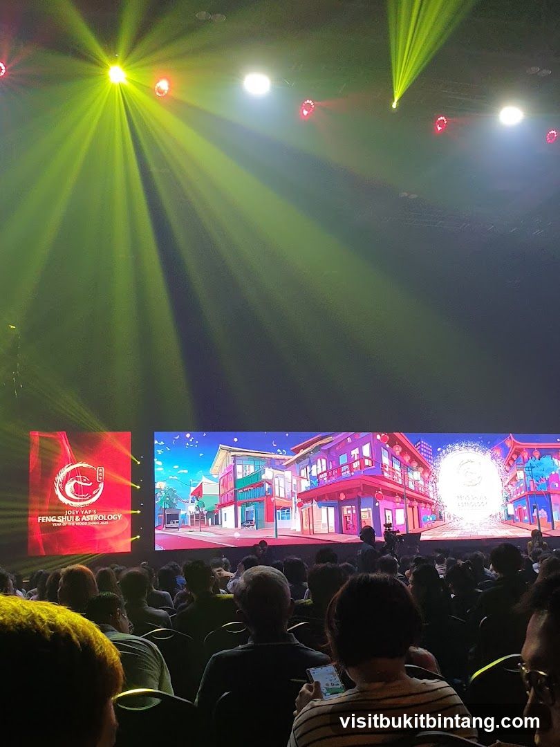 Event with stage lighting and screen display