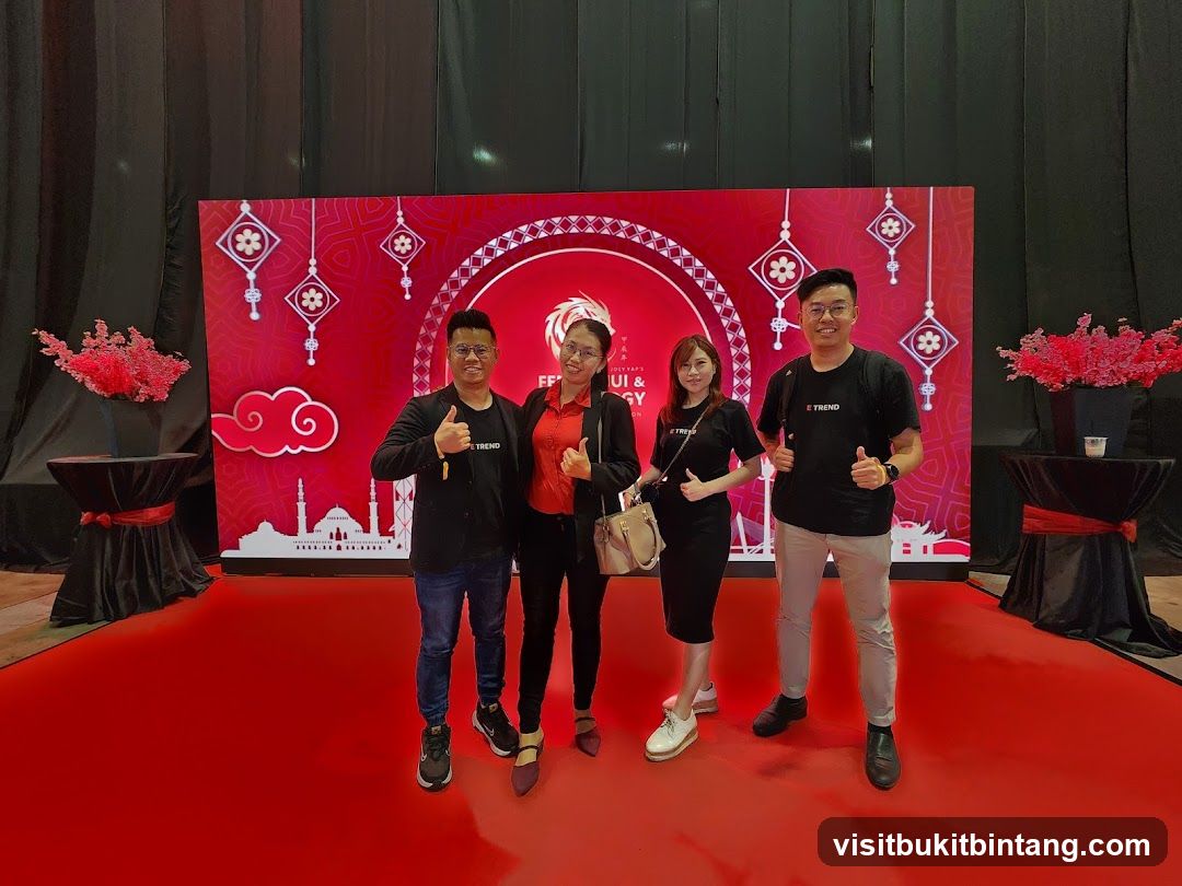 Group posing in front of a festive backdrop