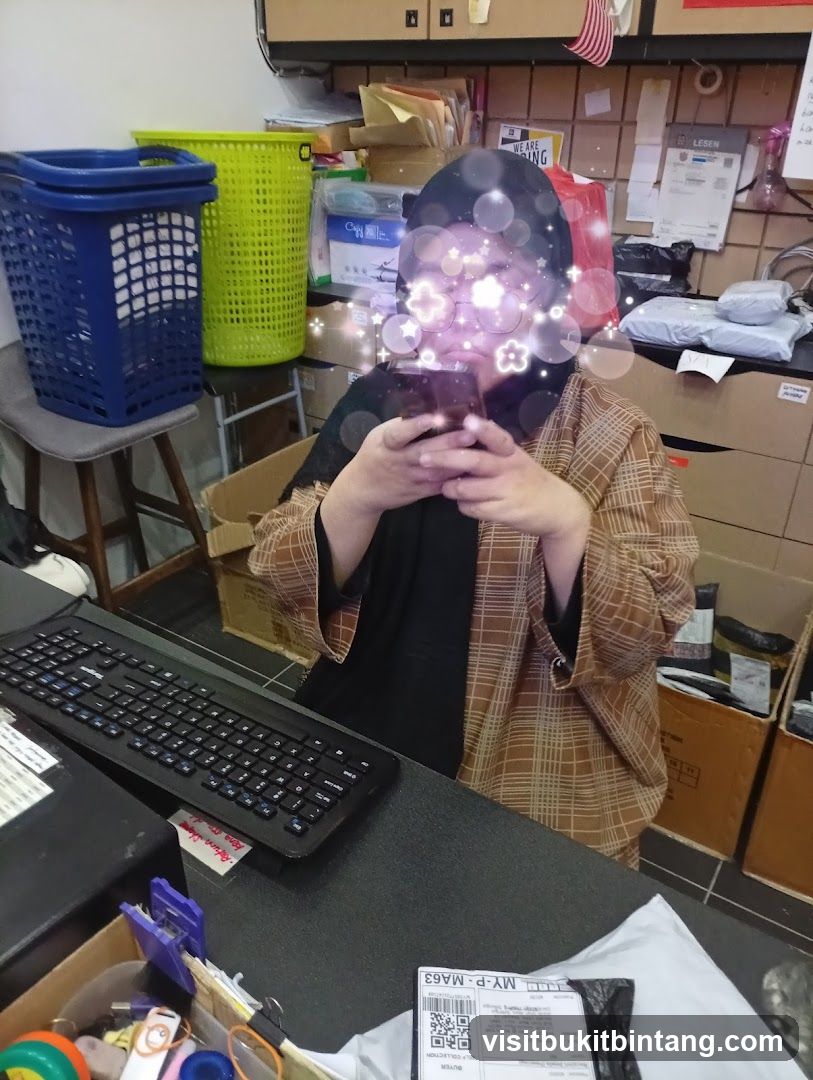 Person using a smartphone at a desk