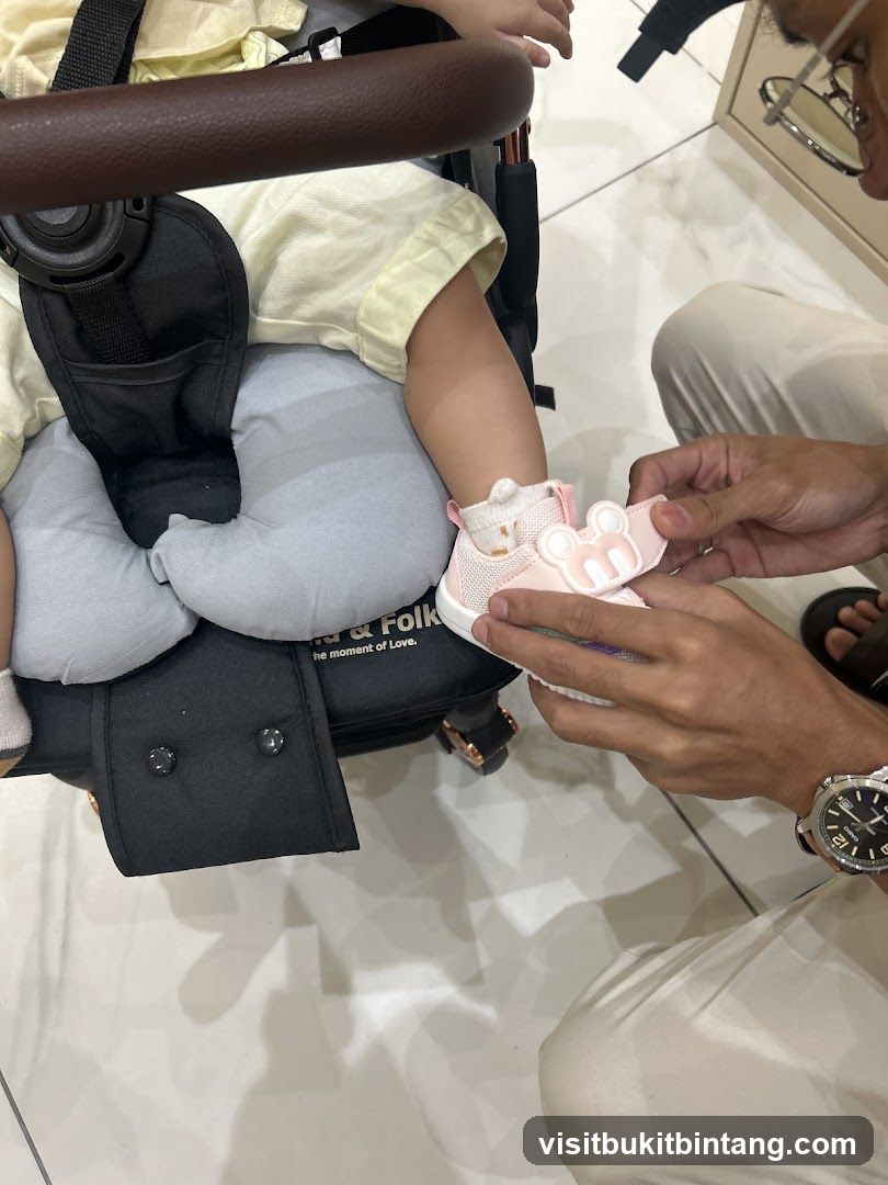 Putting on a baby shoe