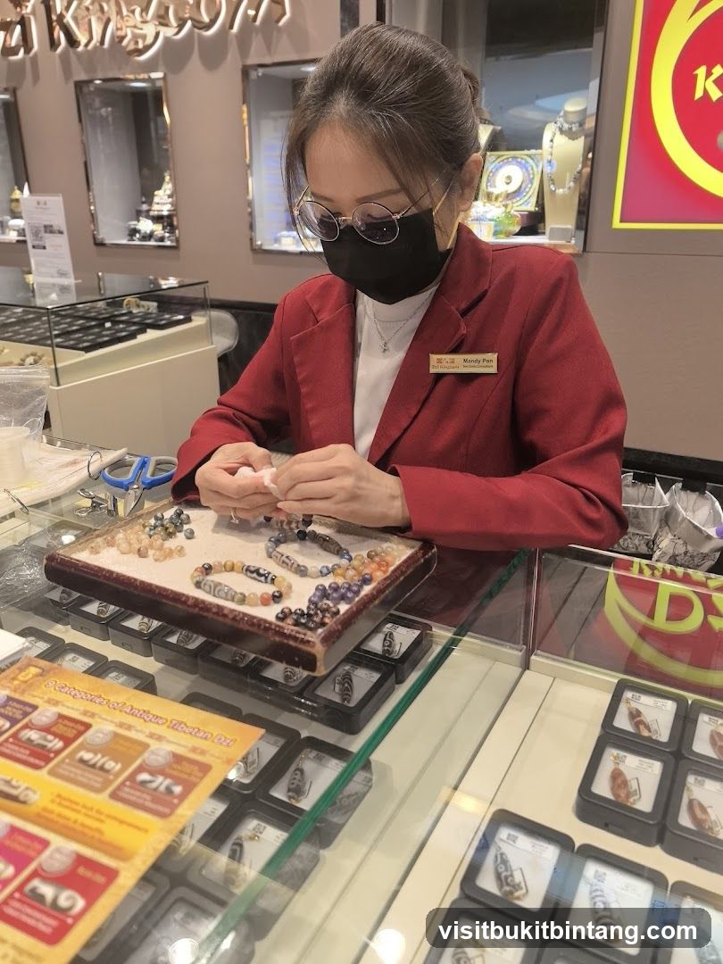Jewelry store employee working with beads