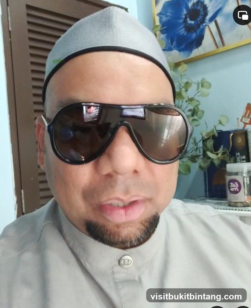 Man wearing sunglasses and a cap