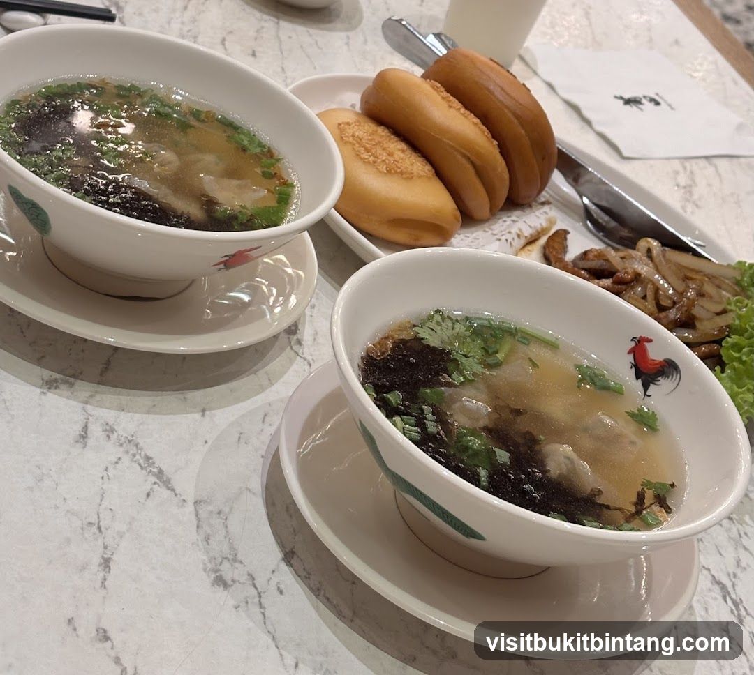 Two bowls of soup with fried buns