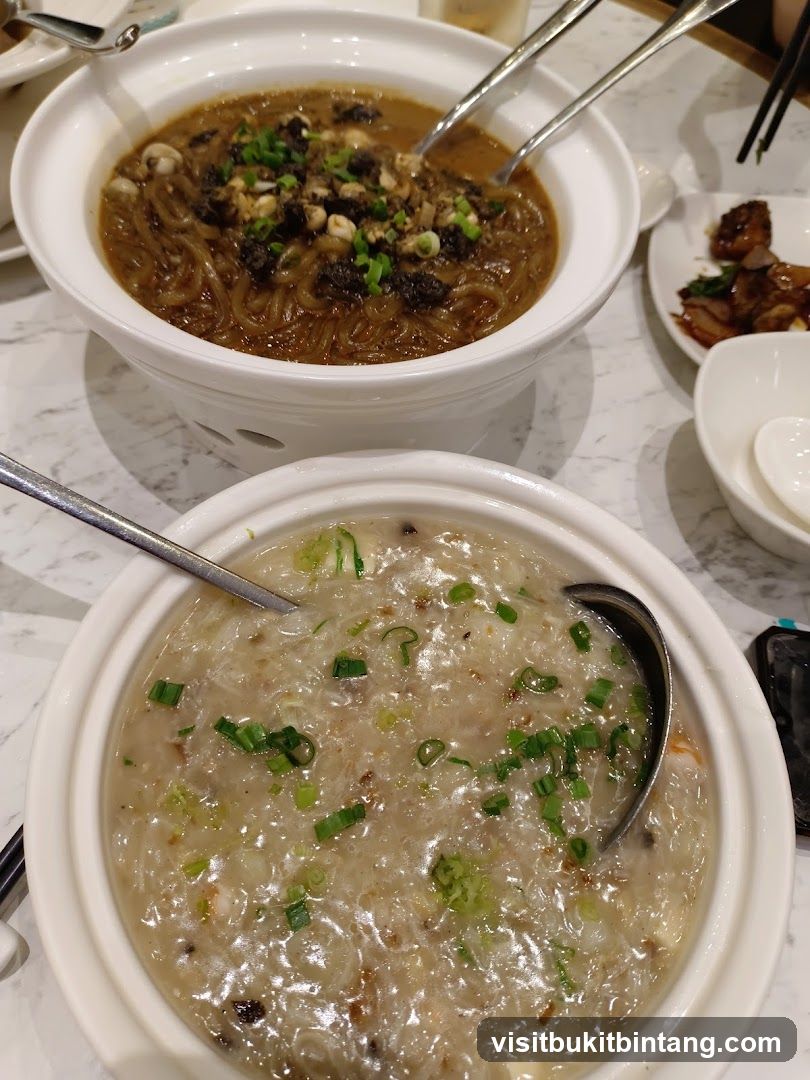 Two bowls of soup with noodles and toppings