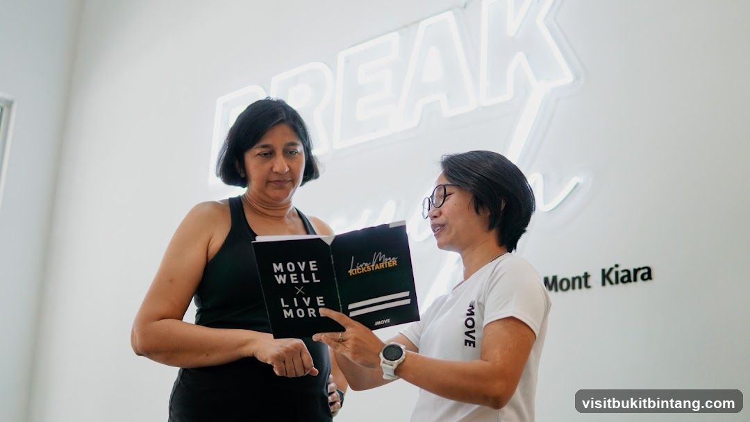 Two women discussing a booklet
