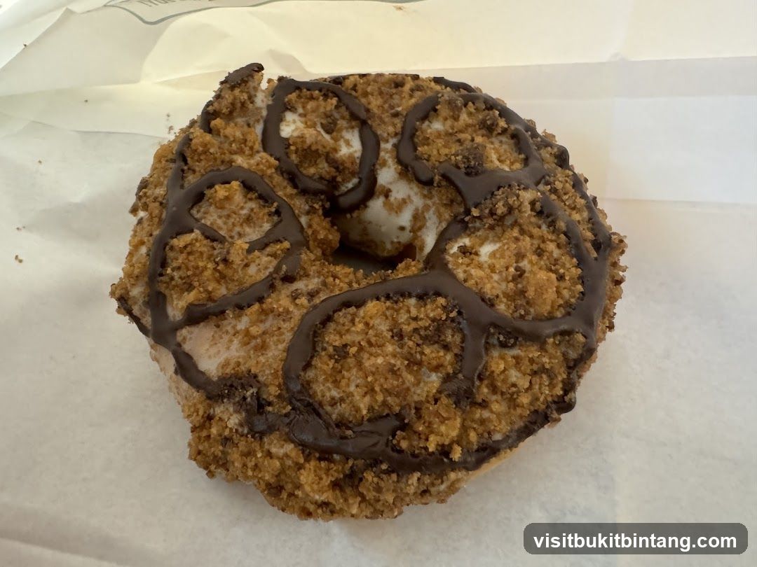 Donut with Chocolate Drizzle and Crumble Topping