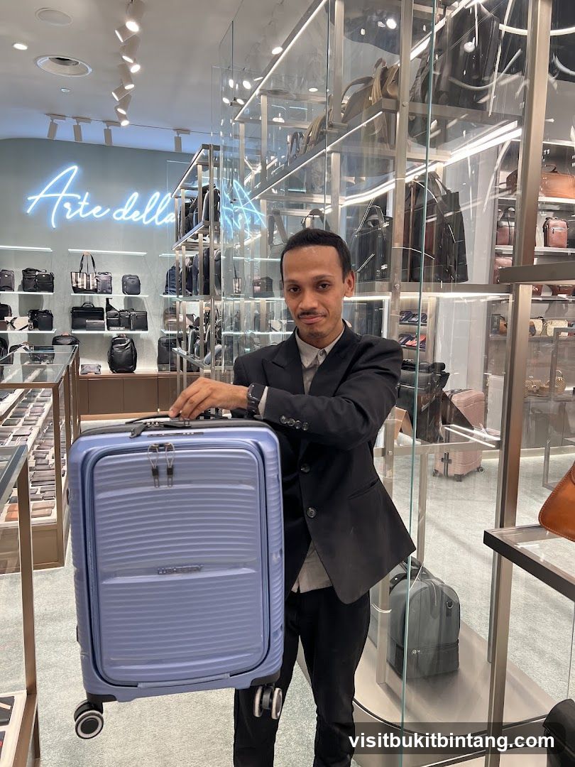 Man holding a suitcase in a store