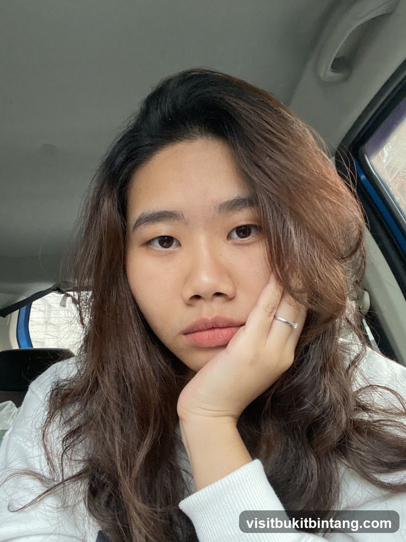 Woman resting her chin on her hand