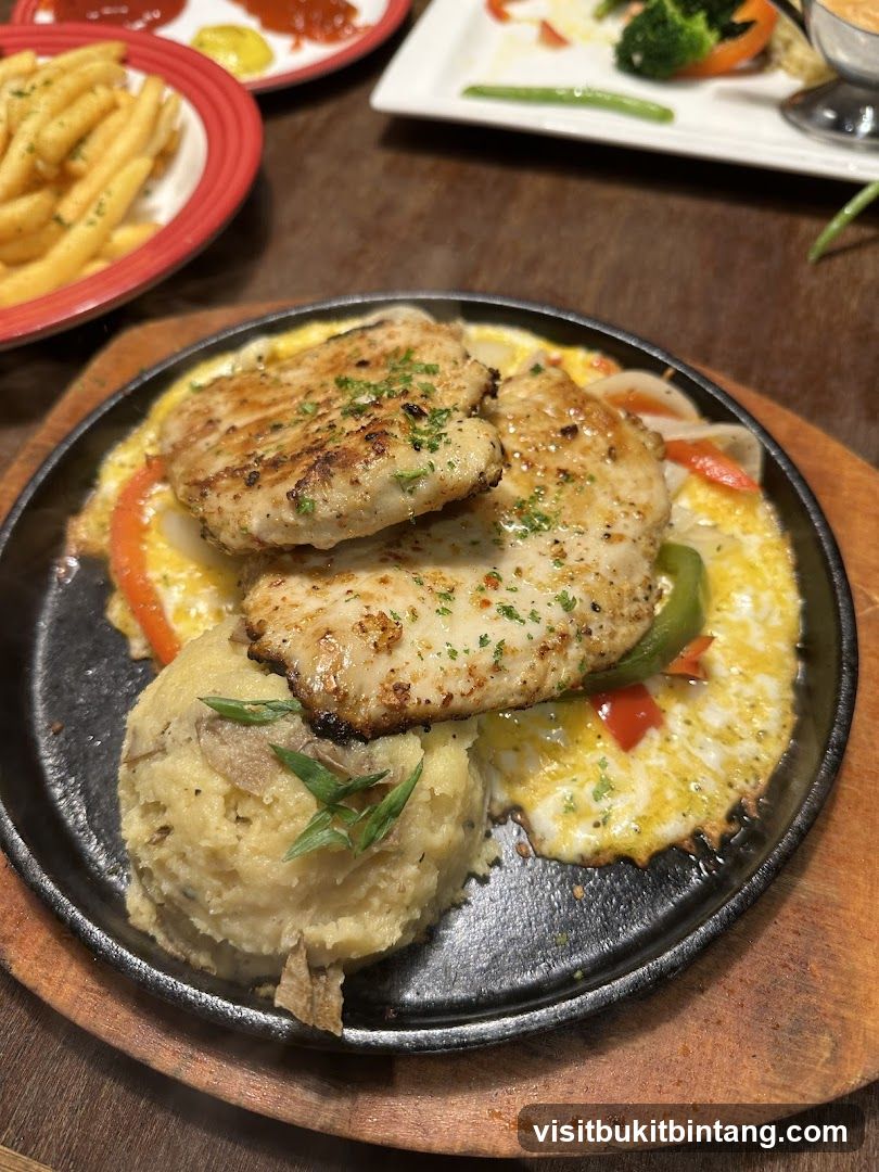 Sizzling Chicken Steak with Mashed Potatoes and Fries