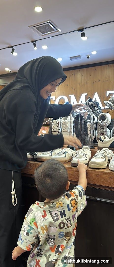 Woman and Child Looking at Shoes