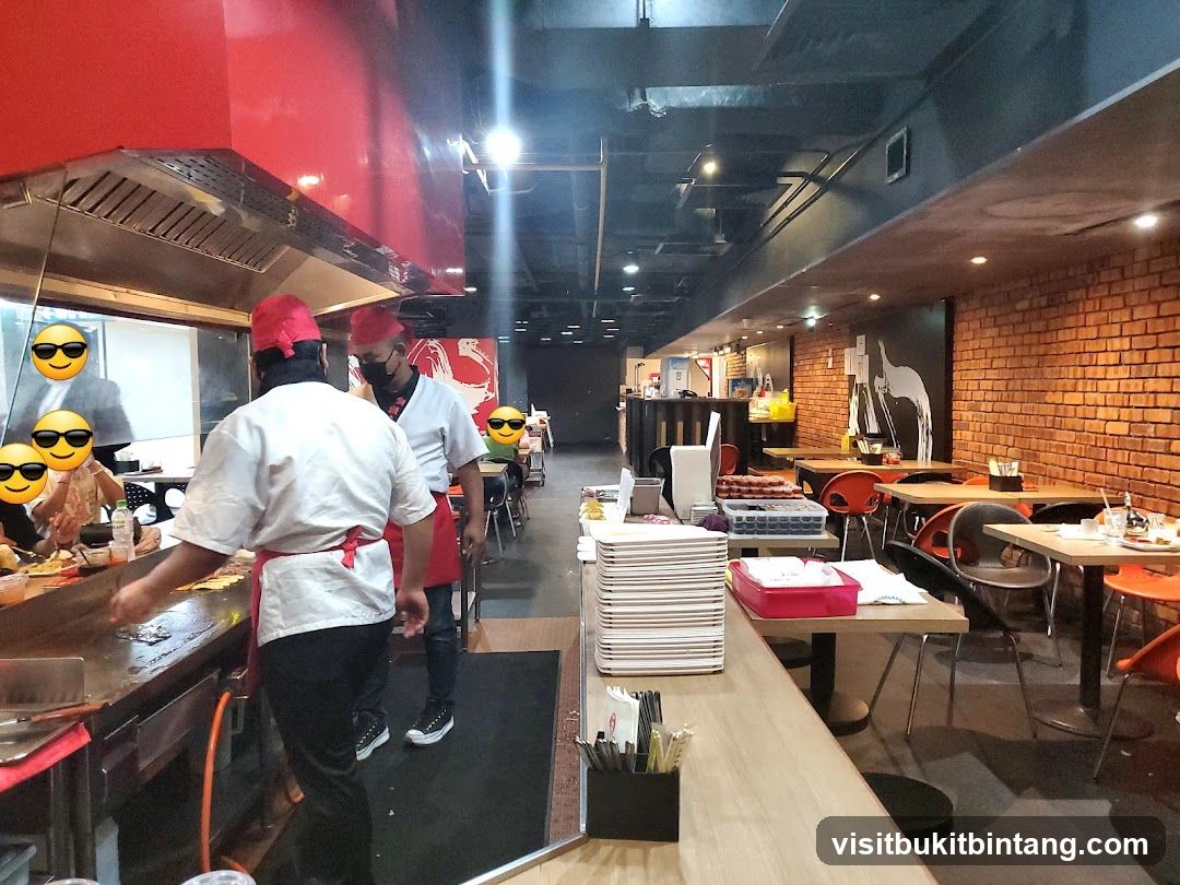 Restaurant Interior with Chefs and Dining Area