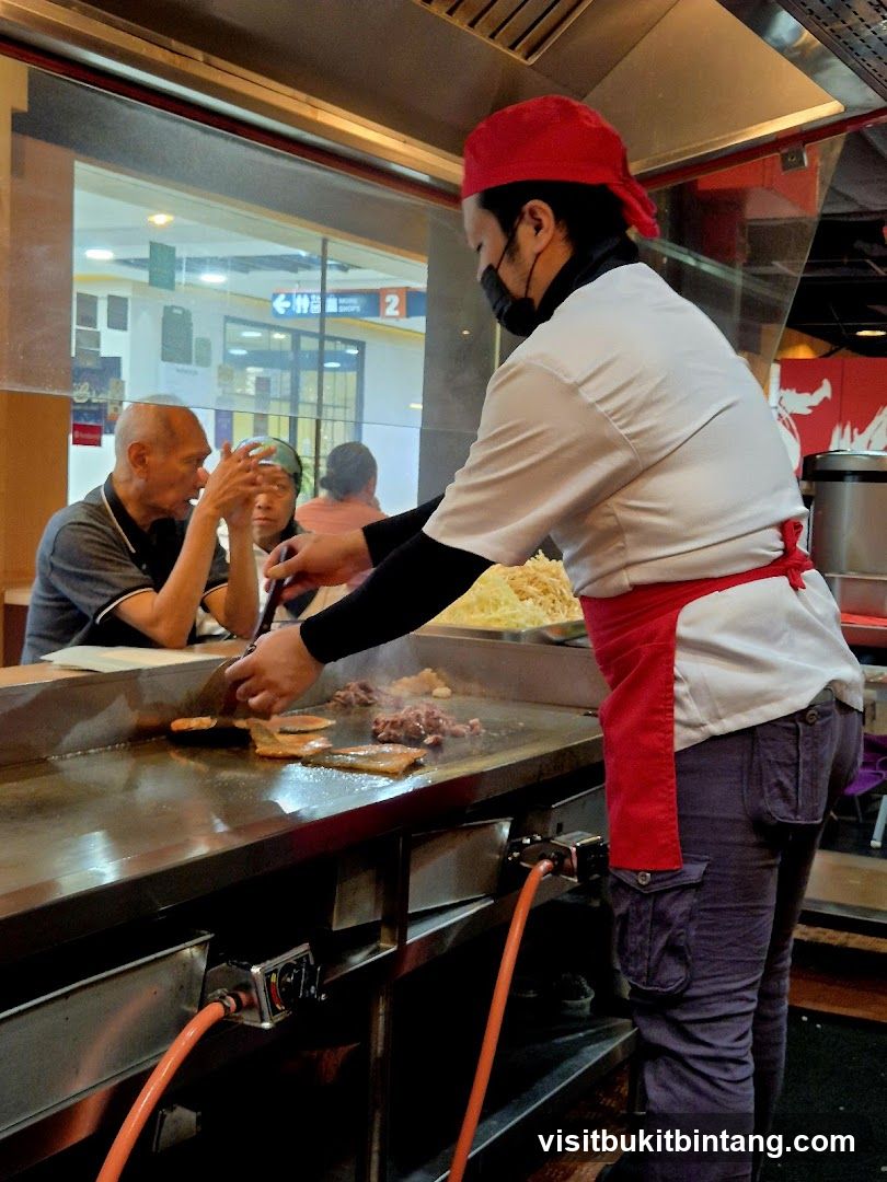 Chef cooking on a griddle