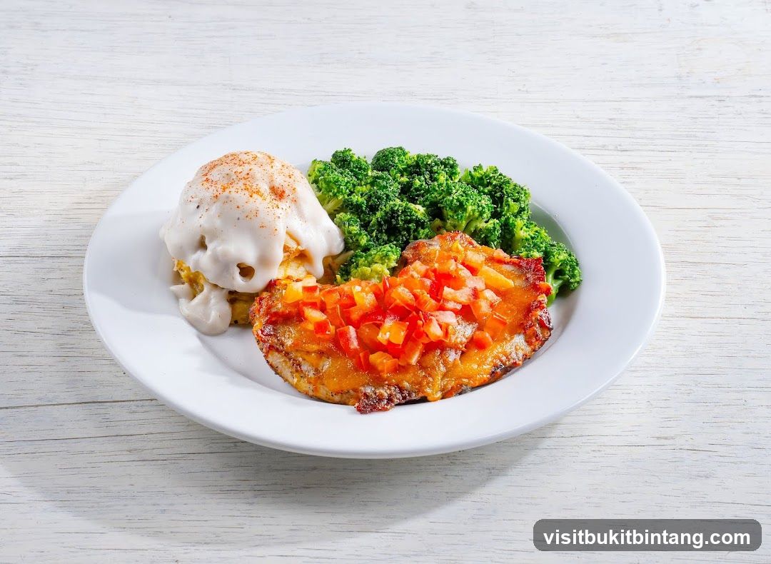 Chicken dish with broccoli and mashed potatoes