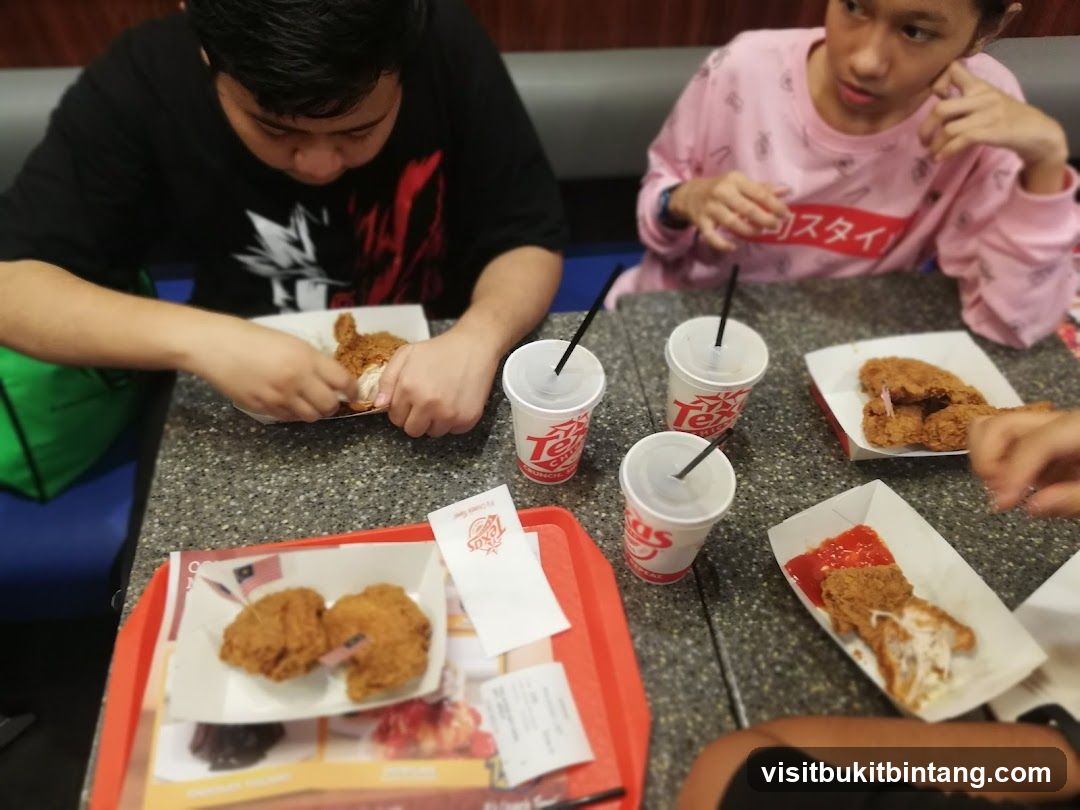 People eating fried chicken
