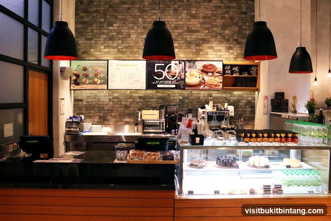 Cafe Counter with Pastries and Drinks