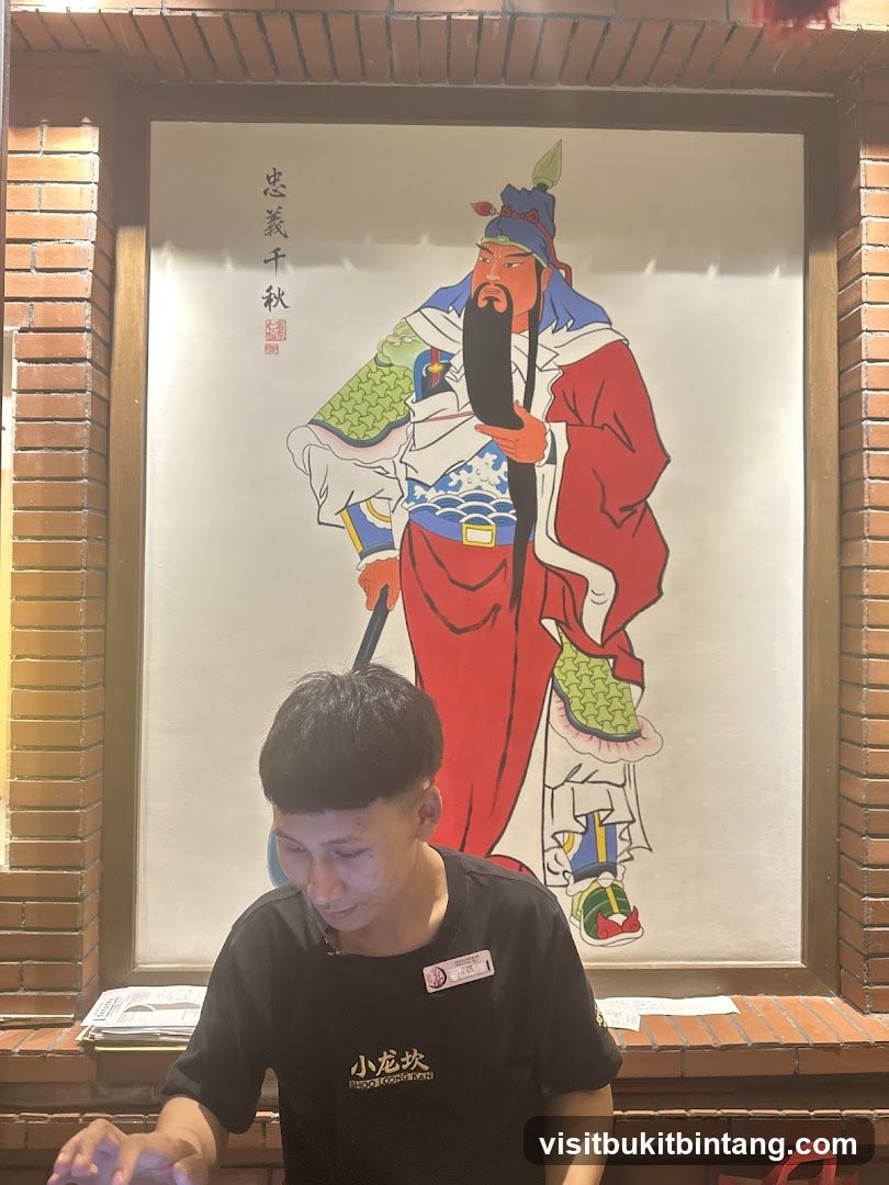 Staff Member in Front of Wall Art