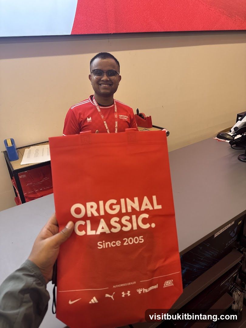 Man holding a branded bag