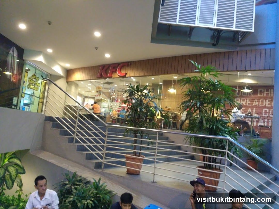 KFC Interior View with Stairs and Plants