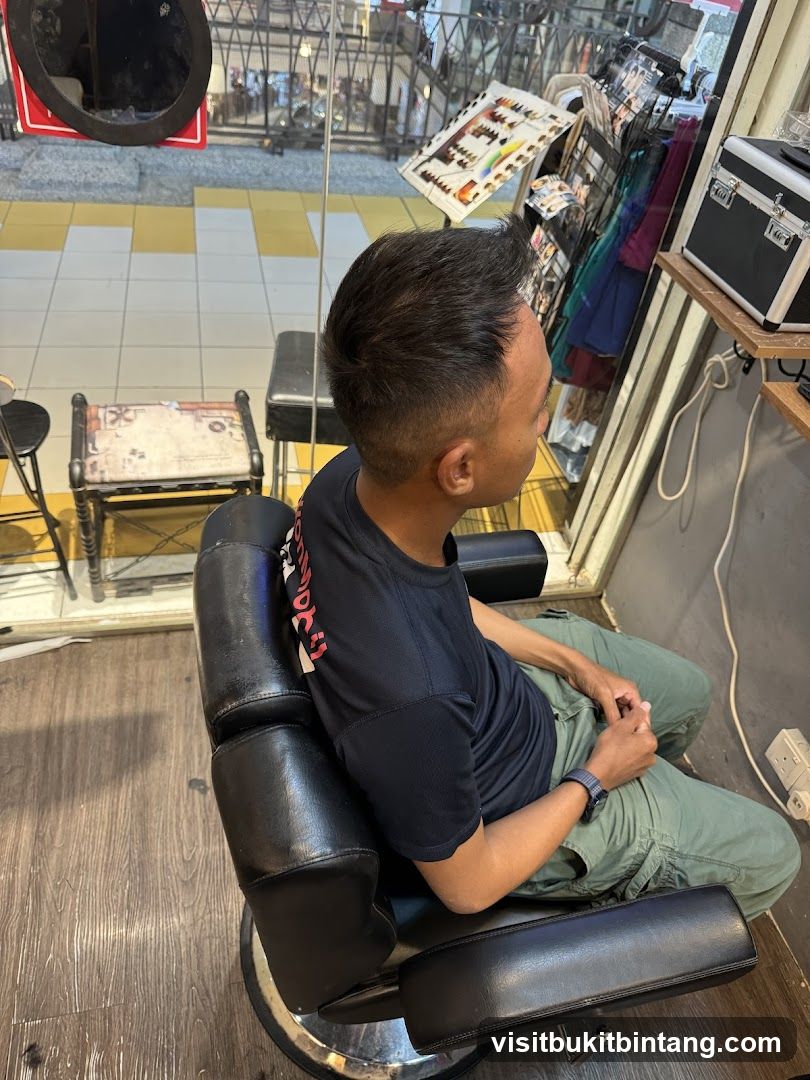 Man sitting in a barber chair