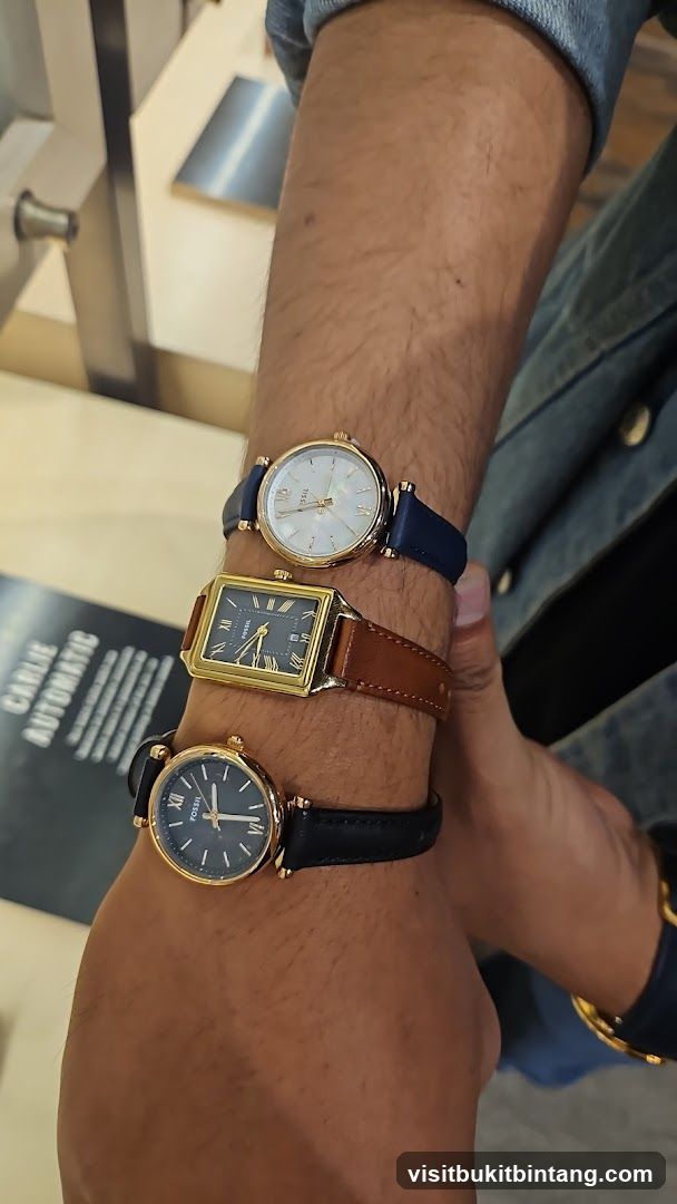Three Fossil Watches on a Wrist