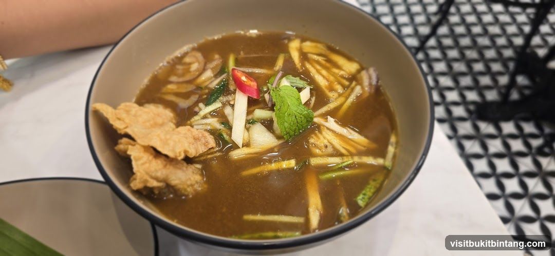 Bowl of Soup with Fried Crisps and Garnishes